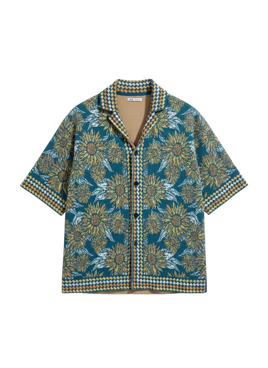 Thingy men's short-sleeve collared shirt with a teal base and a bold yellow floral print. Features a textured knit and geometric trim.