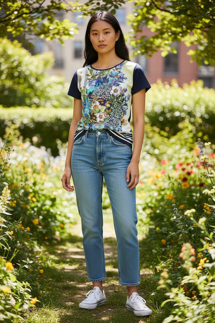Thingy women's short sleeve t-shirt with a vibrant floral bouquet print, navy crew neck, and striped hem.
